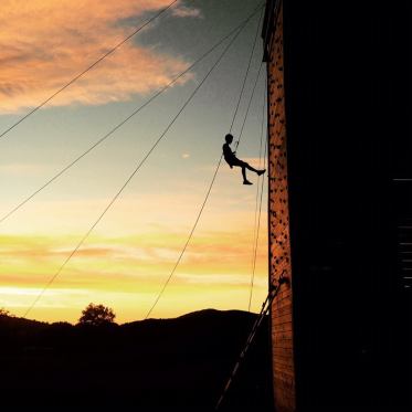 summer camp counselor climbing