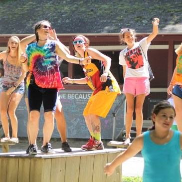Summer Camp dancing on benches