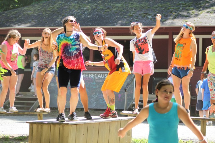 Summer Camp dancing on benches